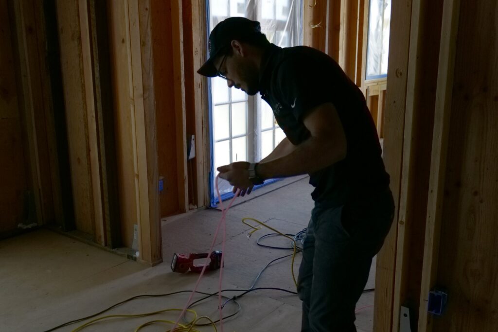 A homeowner chooses Aeroseal Envelope over airtight drywall by hiring Calbarrier to perform home air sealing